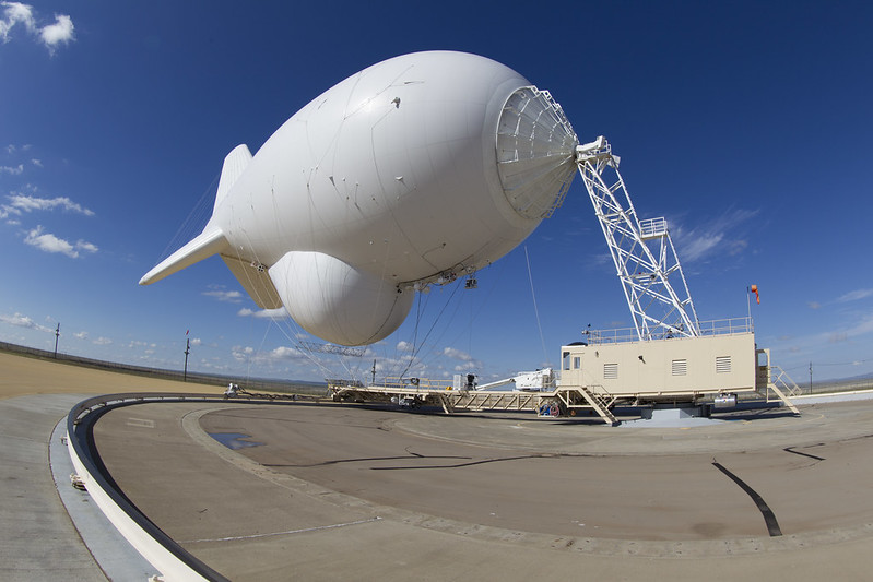 A white blimp known as an aerostat is moored in Marfa