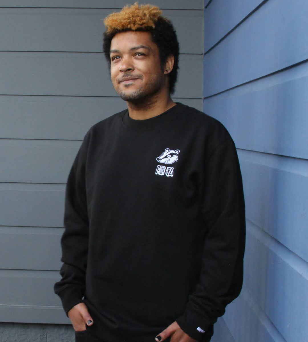 Get an embroidered Privacy Badger crewneck when you join EFF. A person wearing a black sweatshirt with an embroidered Privacy Badger mascot on the chest over the characters for ‘privacy” in Traditional Chinese.